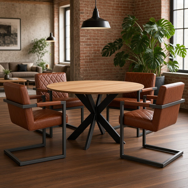Loft-Essbereich mit rundem Esstisch TALMA und Freischwingern FLEET SHANGHAI mit Armlehnen in Cognac-Büffelleder – derstuhl.at